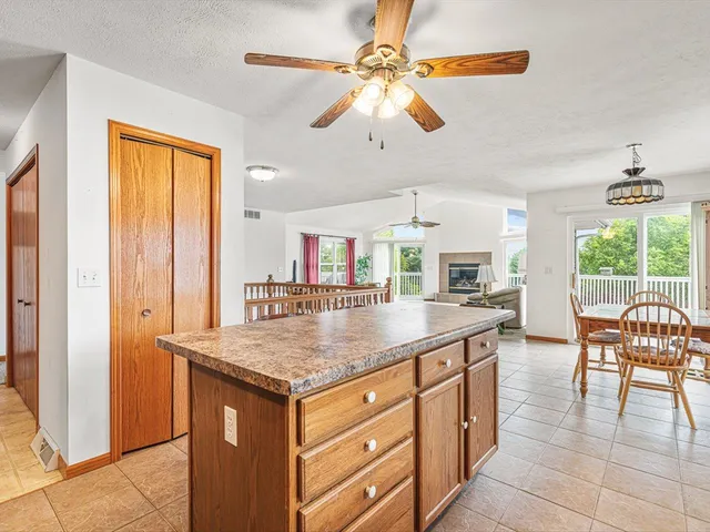 a kitchen with stainless steel appliances granite countertop a stove and a refrigerator