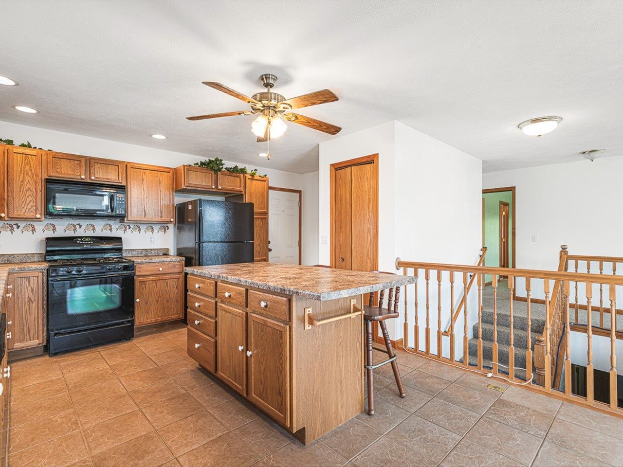 1106 Drexel Road Lake Summerset, IL 61019 - Photo 17 of 43 a kitchen with stainless steel appliances granite countertop a stove and a refrigerator