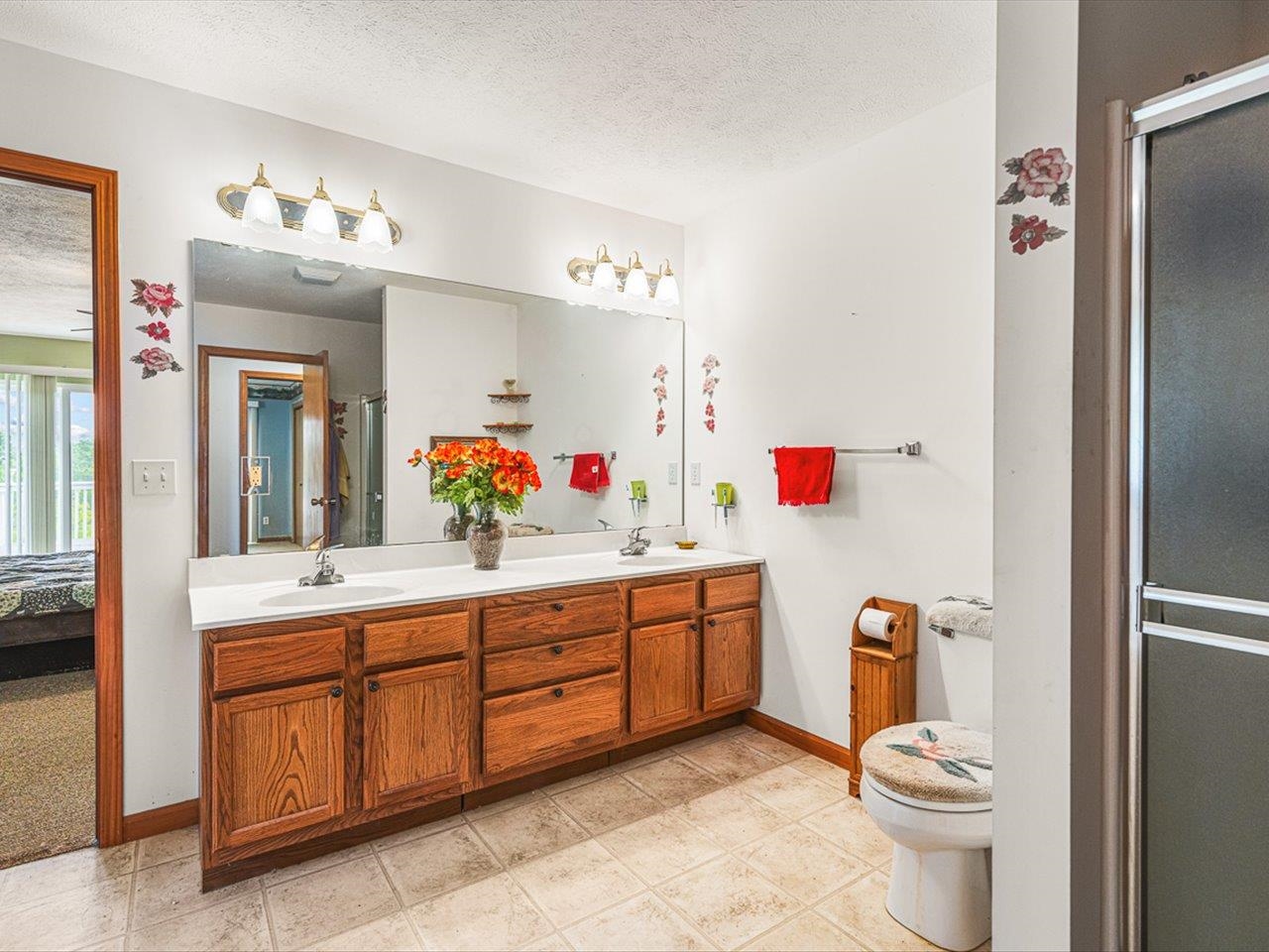 1106 Drexel Road Lake Summerset, IL 61019 - Photo 24 of 43 a bathroom with a sink vanity mirror and toilet