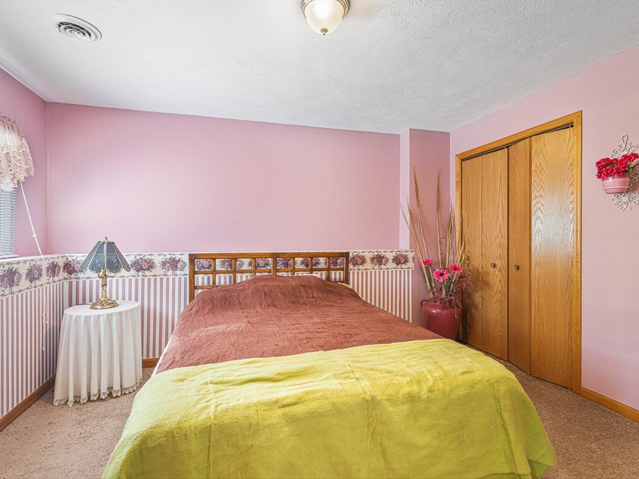 1106 Drexel Road Lake Summerset, IL 61019 - Photo 28 of 43 a bed sitting in a bedroom next to a window