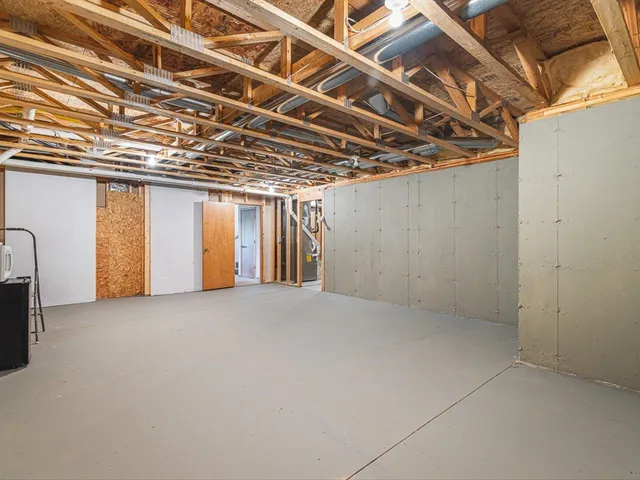 a view of a house with a wooden deck