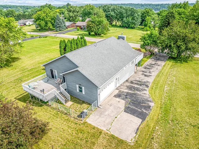 a front view of house with yard and green space