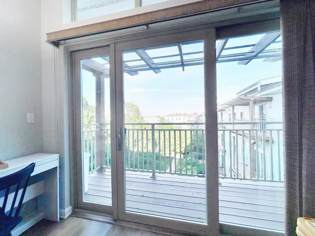 a view of a room with a large window