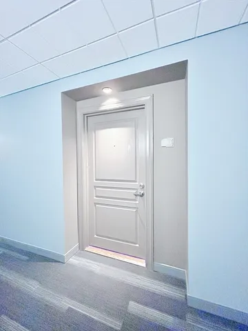 a view of a livingroom from a hallway