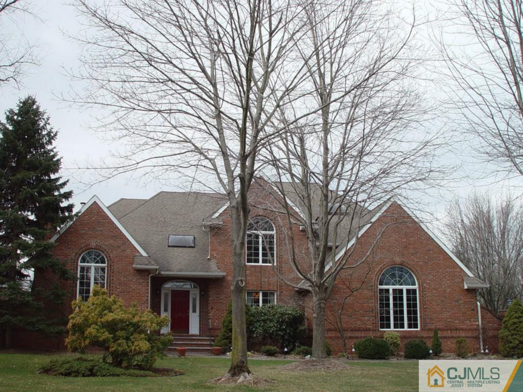 8 Maher Road Somerset, NJ 08873 - Photo 1 of 25 a front view of a house with a garden and trees