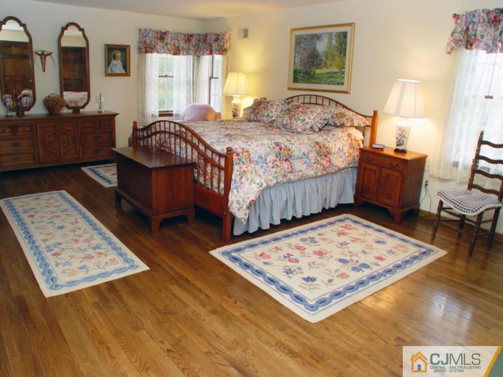 8 Maher Road Somerset, NJ 08873 - Photo 13 of 25 a living room with a bed and a table