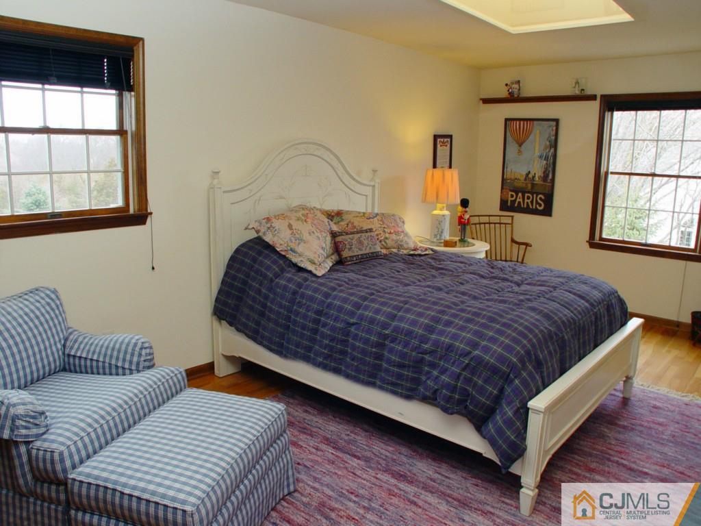 8 Maher Road Somerset, NJ 08873 - Photo 16 of 25 a bedroom with a bed couch and window