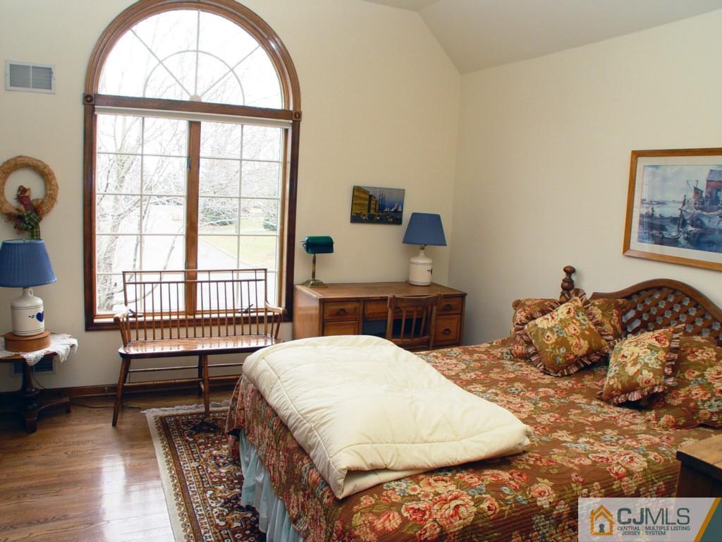 8 Maher Road Somerset, NJ 08873 - Photo 19 of 25 a bedroom with a bed and a large window