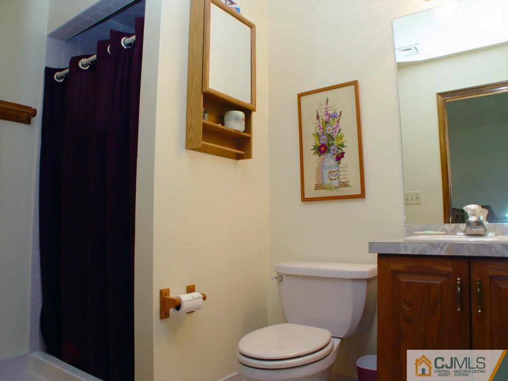 8 Maher Road Somerset, NJ 08873 - Photo 20 of 25 a white toilet sitting next to a bathroom sink
