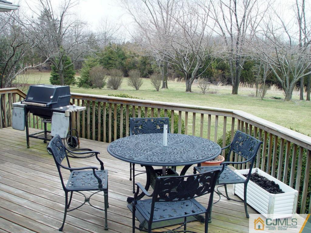 8 Maher Road Somerset, NJ 08873 - Photo 23 of 25 a view of a chairs and table on the deck
