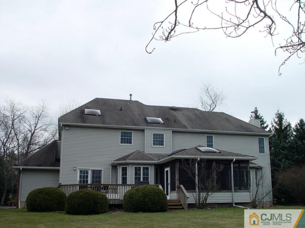 8 Maher Road Somerset, NJ 08873 - Photo 24 of 25 a front view of a house with a garden and yard