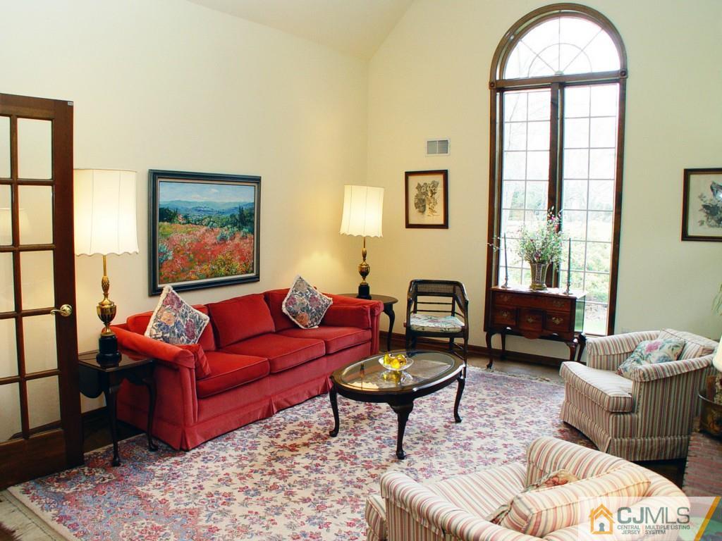 8 Maher Road Somerset, NJ 08873 - Photo 4 of 25 a living room with furniture or couch and a window