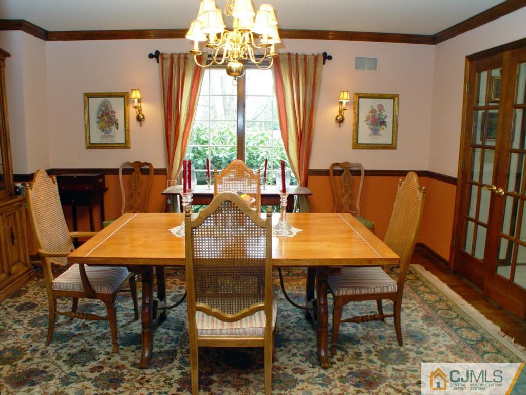 8 Maher Road Somerset, NJ 08873 - Photo 5 of 25 a view of a dining room with furniture window and wooden floor