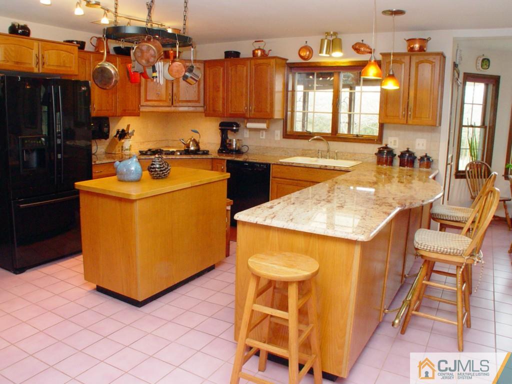 8 Maher Road Somerset, NJ 08873 - Photo 8 of 25 a kitchen that has a sink and a stove