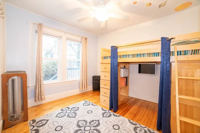 a bedroom with furniture and a window