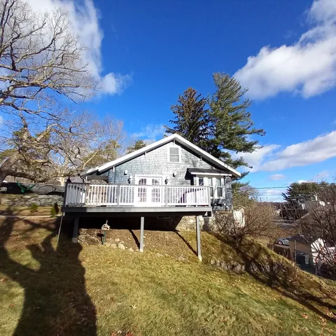 a small pool with a table and chairs