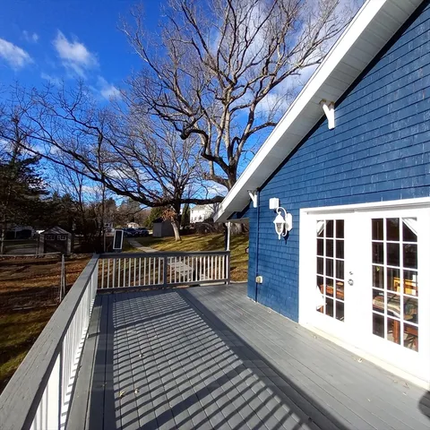 a view of balcony with wooden floor