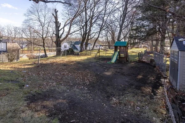 a view of outdoor space with deck and trees