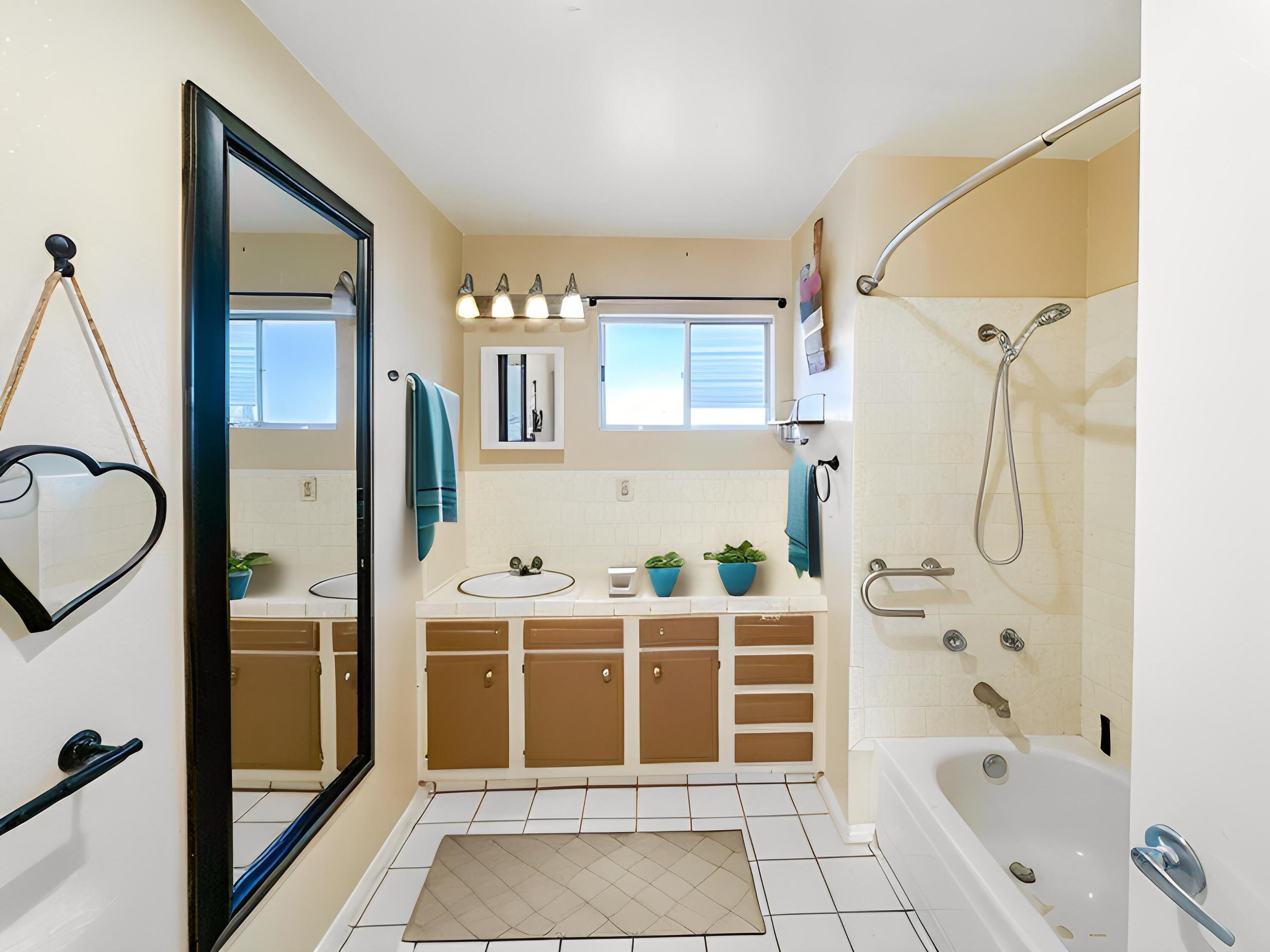 1228 West St George Avenue Ridgecrest, CA 93555 - Photo 12 of 30 a bathroom with a bathtub and a shower