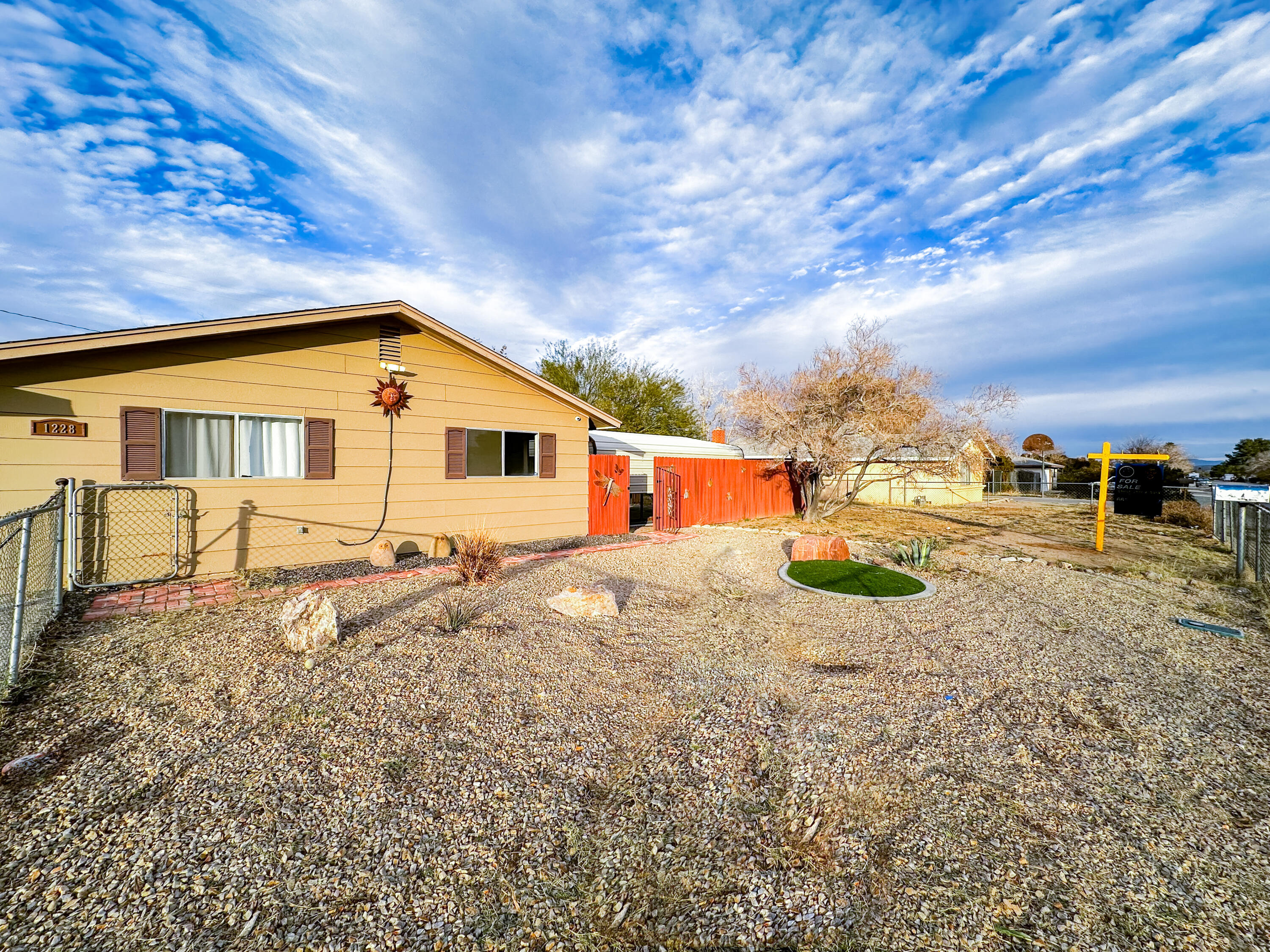 1228 West St George Avenue Ridgecrest, CA 93555 - Photo 2 of 30 a front view of a house with a yard