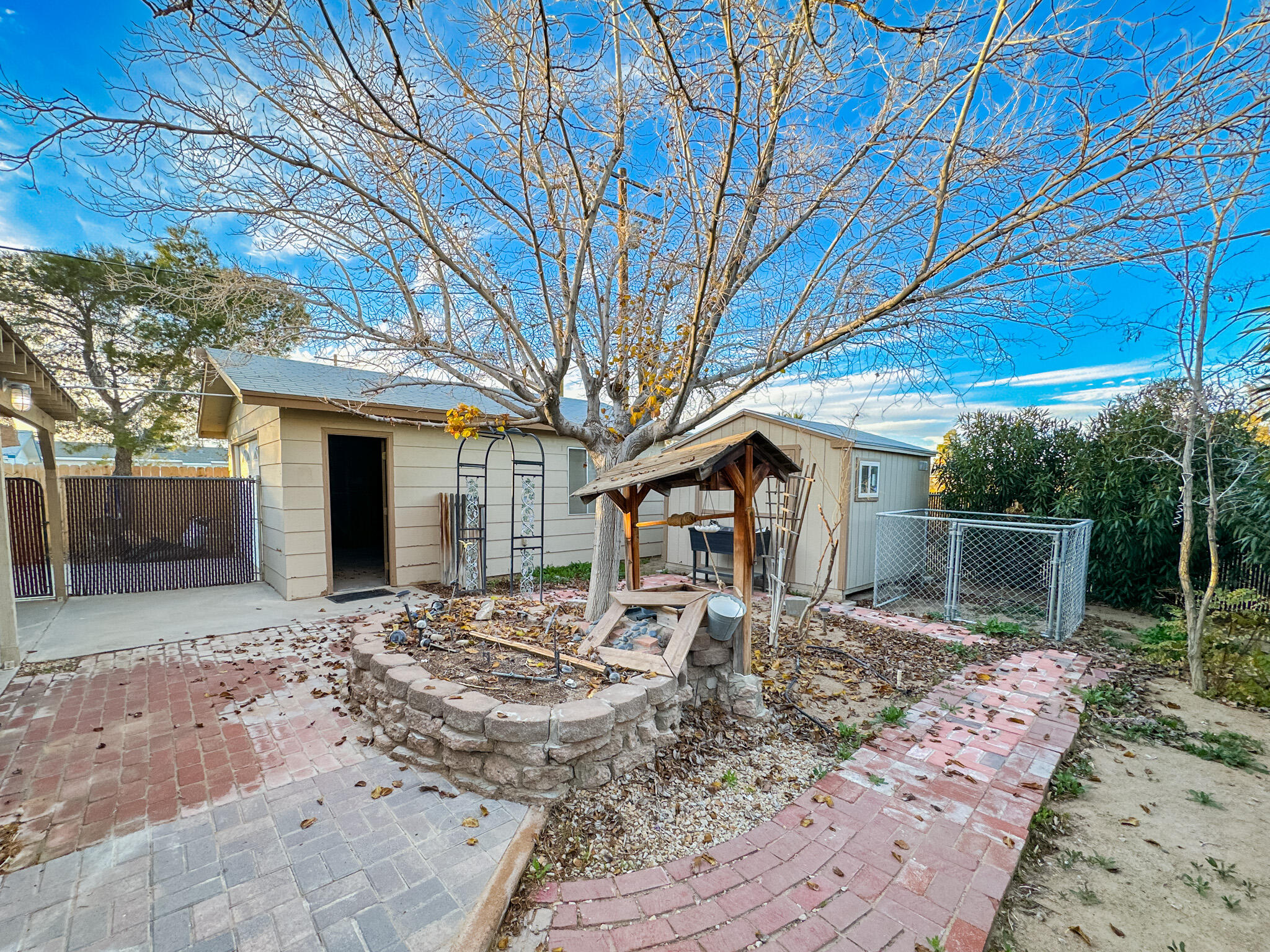 1228 West St George Avenue Ridgecrest, CA 93555 - Photo 22 of 30 a front view of a house with garden