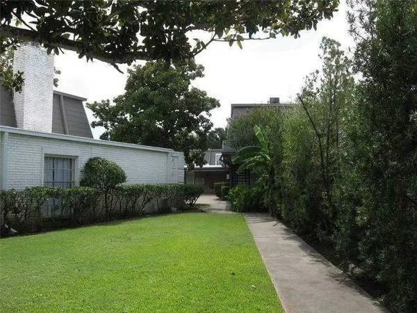 a view of a house with swimming pool and sitting area