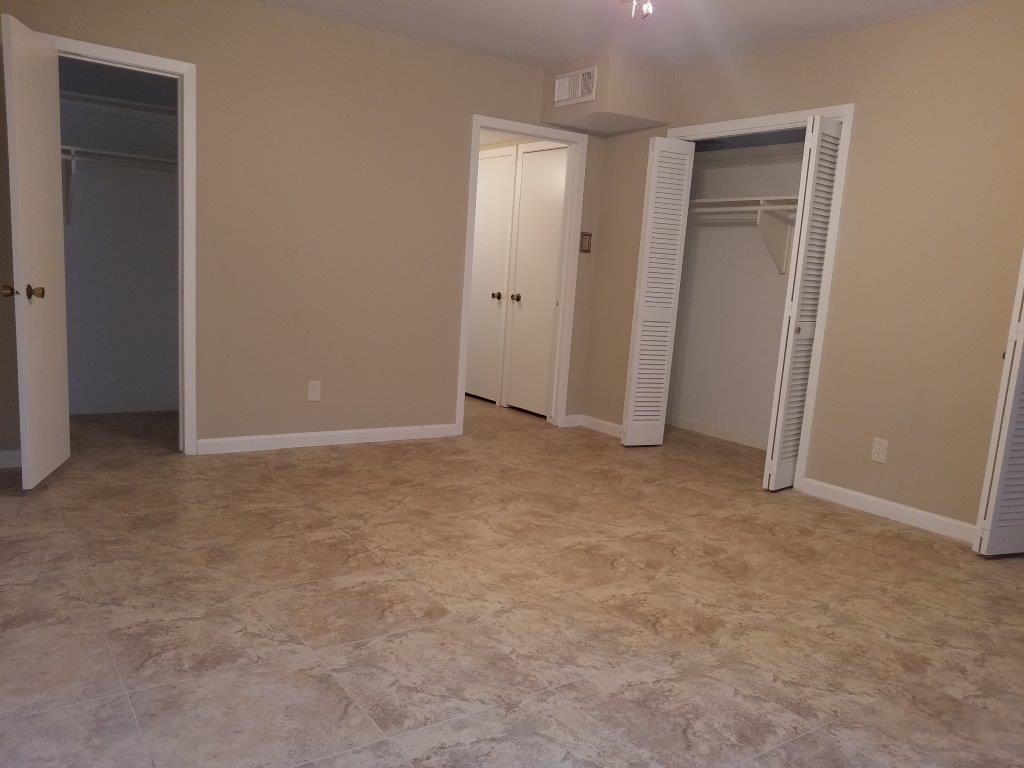 9031 Rue Cambon Street, Unit 69 Houston, TX 77074 - Photo 3 of 13 an empty room with closet area
