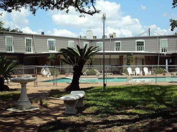 9031 Rue Cambon Street, Unit 69 Houston, TX 77074 - Photo 9 of 13 a front view of a house with garden