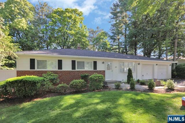 89 Wyoming Road Paramus, NJ 07652 - Photo 1 of 17 a view of a house with backyard and garden