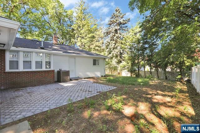 89 Wyoming Road Paramus, NJ 07652 - Photo 2 of 17 a view of backyard of house with green space