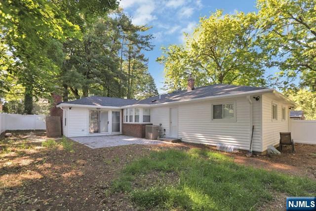89 Wyoming Road Paramus, NJ 07652 - Photo 3 of 17 a backyard of a house with yard and outdoor seating