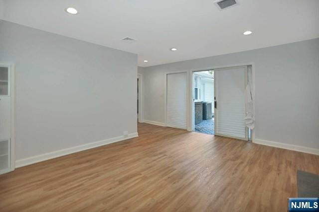 89 Wyoming Road Paramus, NJ 07652 - Photo 7 of 17 a view of an empty room with wooden floor and a window