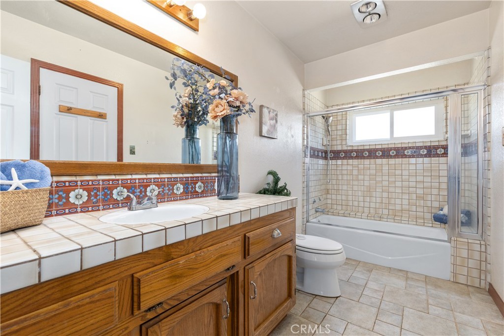 1024 Robin Circle Arroyo Grande, CA 93420 - Photo 18 of 35 a bathroom with a sink a toilet and shower