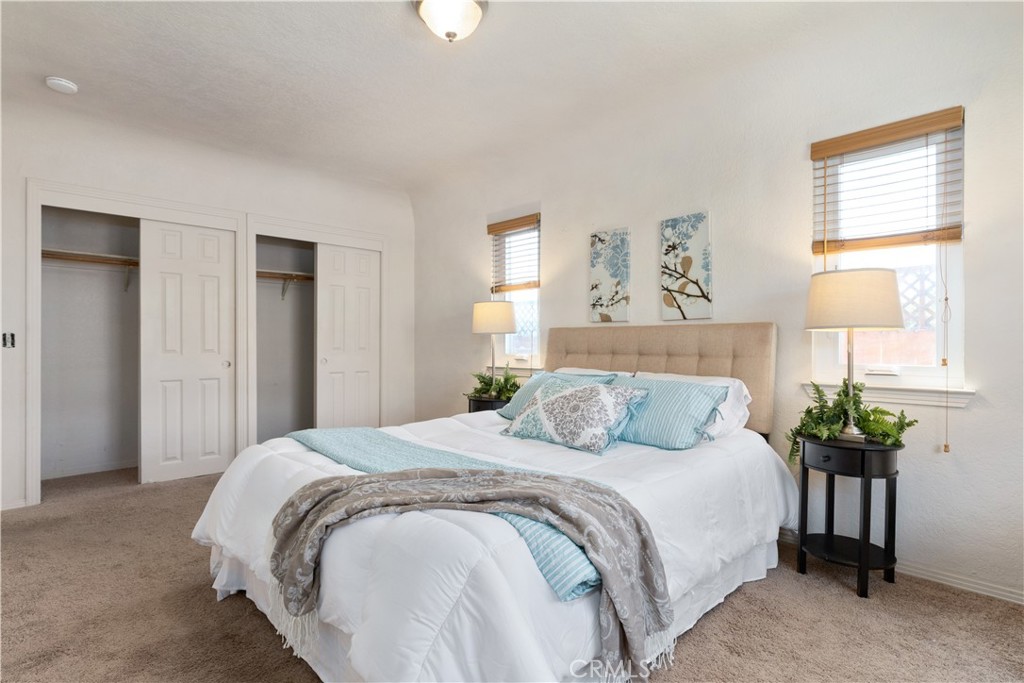1024 Robin Circle Arroyo Grande, CA 93420 - Photo 22 of 35 a bedroom with a bed and a table