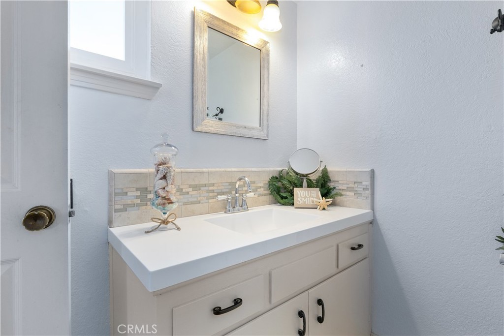 1024 Robin Circle Arroyo Grande, CA 93420 - Photo 23 of 35 a bathroom with a sink and a mirror