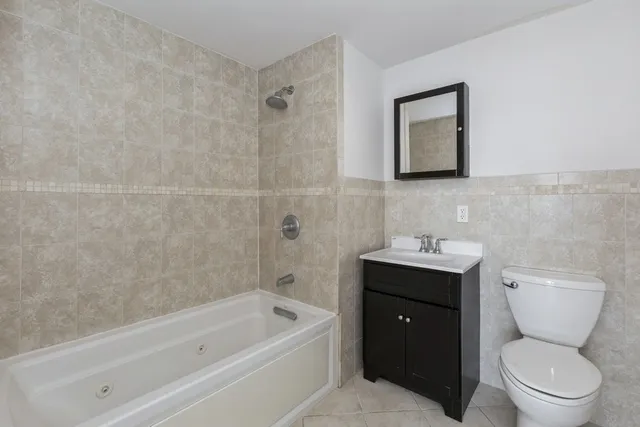 a bathroom with a toilet sink and bathtub