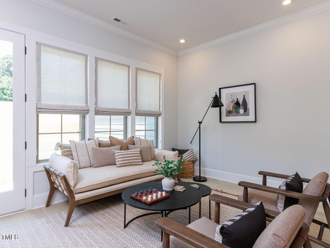 1031 Coldspring Circle Durham, NC 27705 - Photo 13 of 44 a living room with furniture and a large window