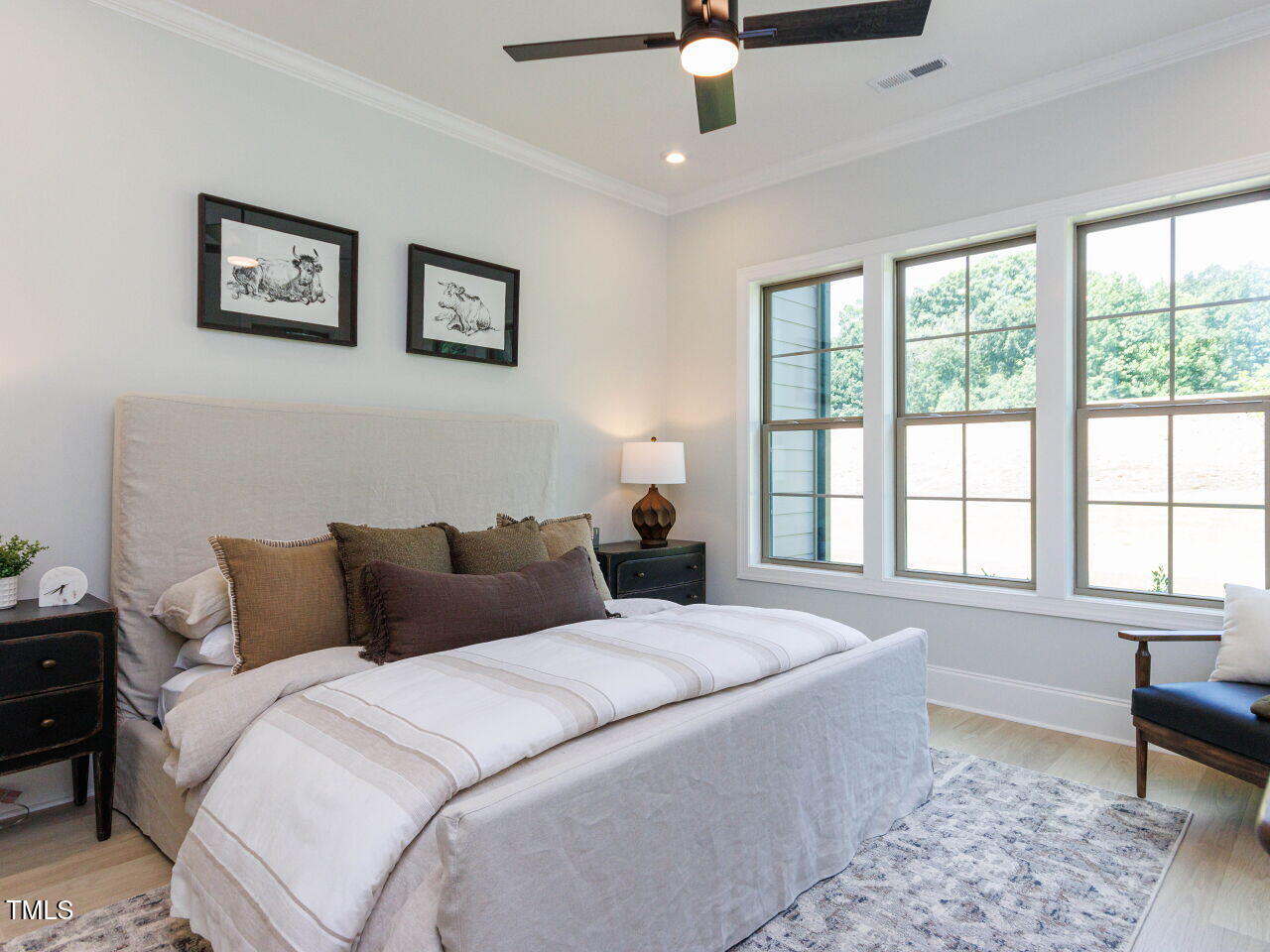 1031 Coldspring Circle Durham, NC 27705 - Photo 16 of 44 a bedroom with a large bed and a window