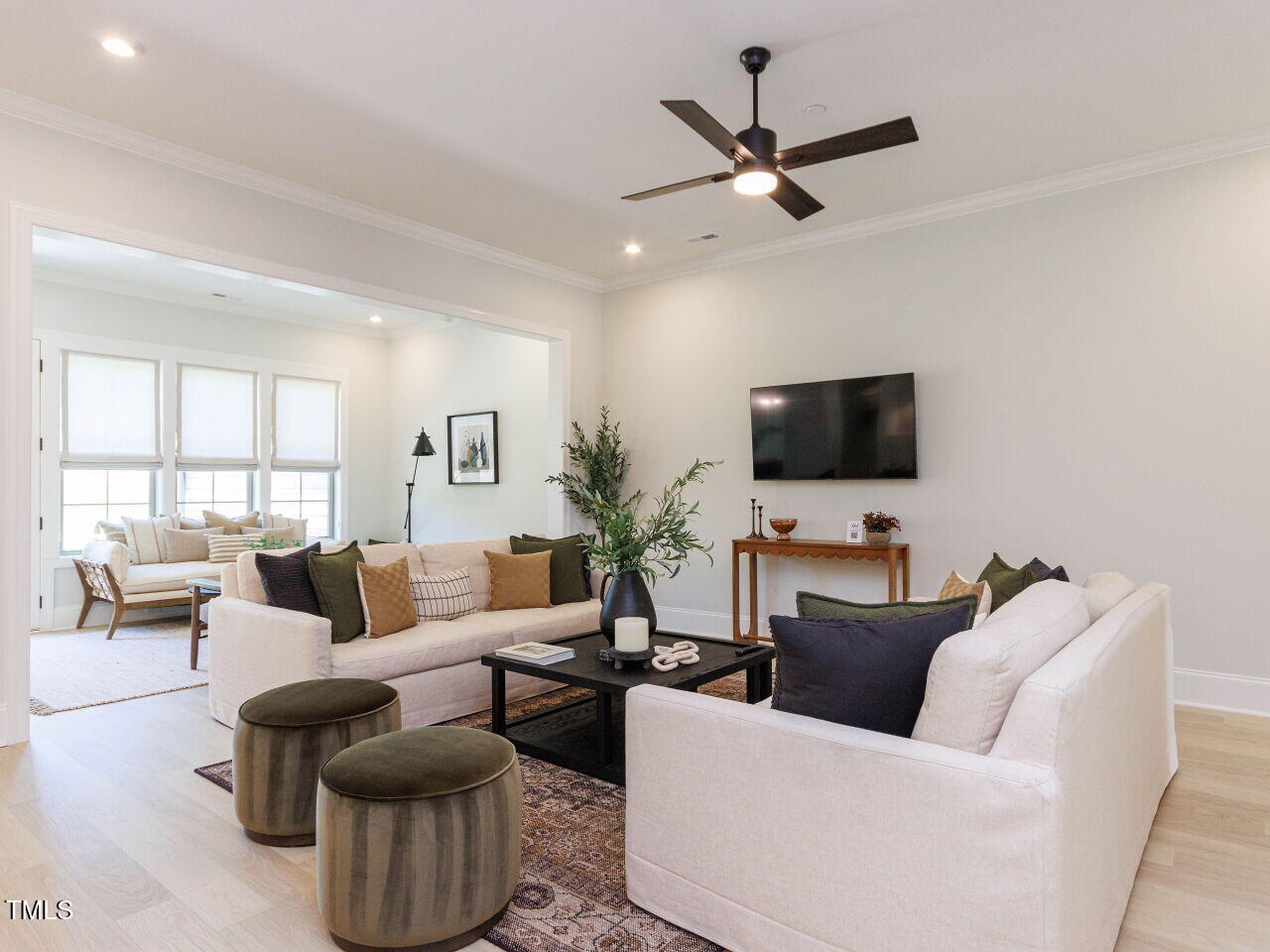 1031 Coldspring Circle Durham, NC 27705 - Photo 6 of 44 a living room with furniture and a flat screen tv