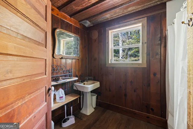 a view of outdoor space with deck and trees