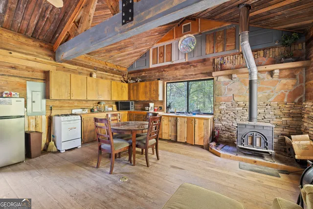 a view of a patio with table and chairs