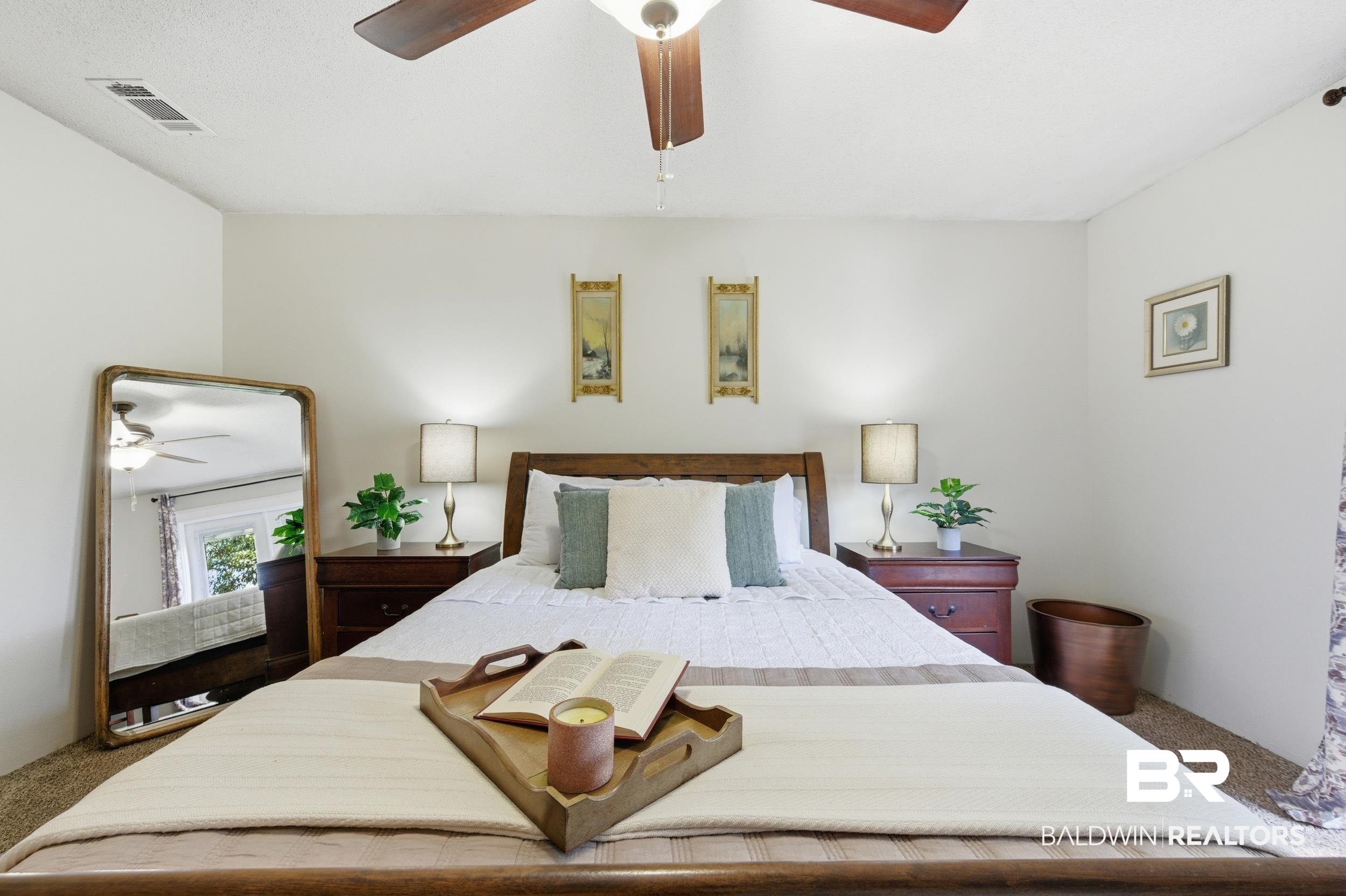 51620 Robert White Road Bay Minette, AL 36507 - Photo 42 of 81 White-painted walls complement the brown carpet flooring and a ceiling fan with integrated lighting