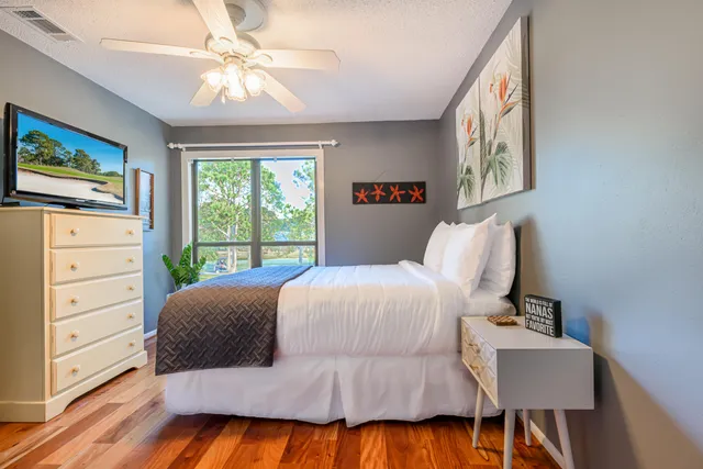 a bedroom with a large bed and a window