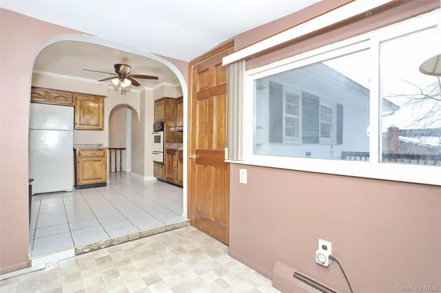 a view of a kitchen with a sink and a window