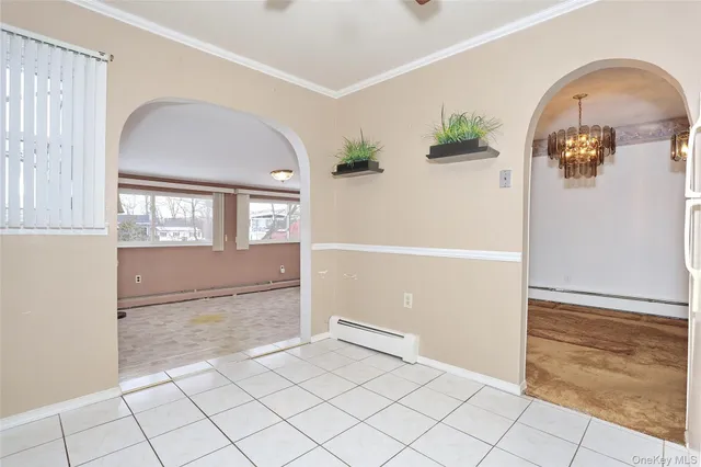 a kitchen with granite countertop a stove a sink and a refrigerator