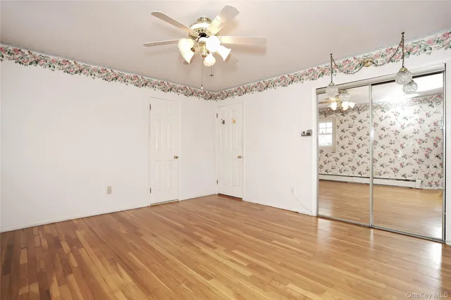 a bathroom with a sink a toilet and a large mirror