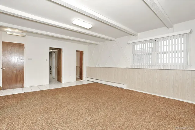 a bathroom with a toilet a sink and a mirror