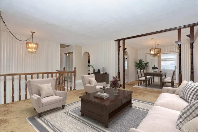 a living room with furniture and a table