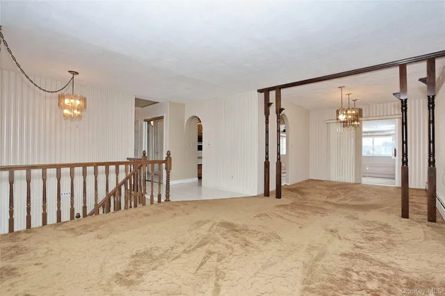 a view of a big room with closet and windows