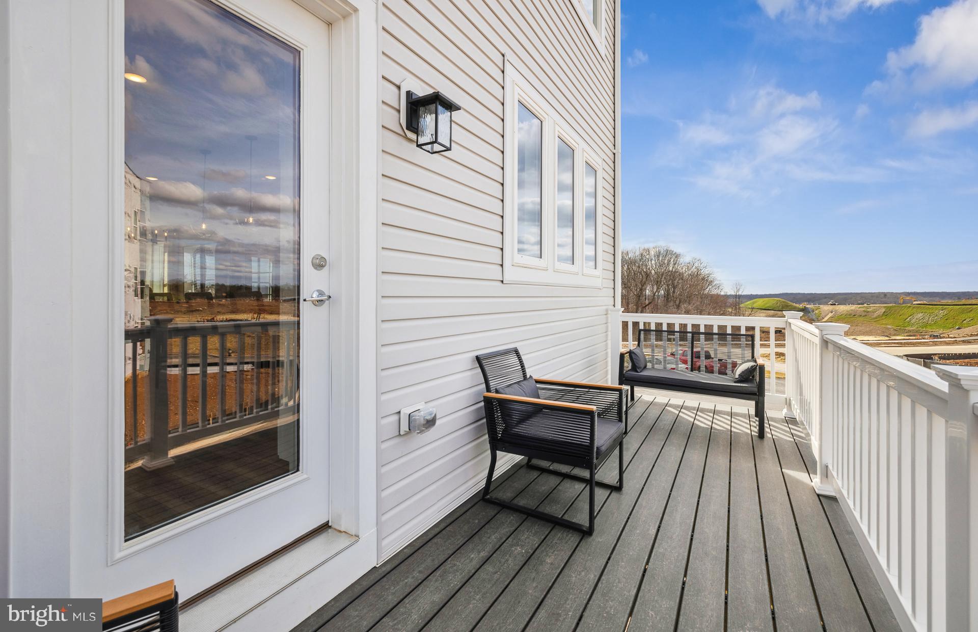 22412 Sculpin Brk Road Boyds, MD 20841 - Photo 15 of 37 a view of a balcony with wooden floor